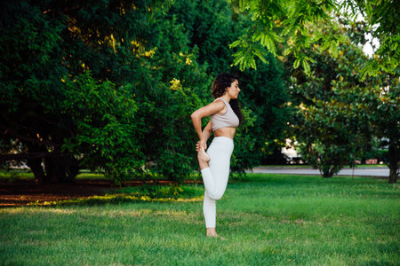 Woman doing yoga exercises asana breathing balanceの写真素材