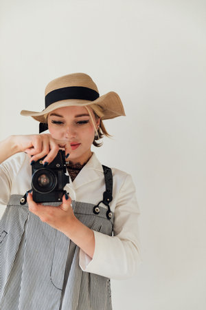 Female photographer taking photos with film camera