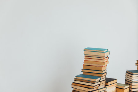 stack of hardcover books on white background, education and reading conceptの写真素材