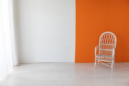 Light armchair in the interior of an orange office roomの写真素材