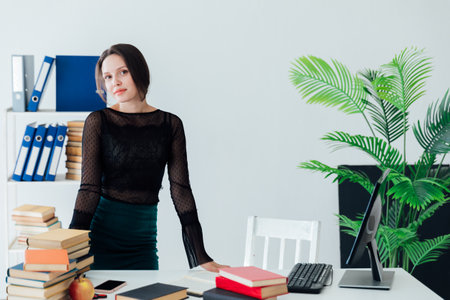 woman working at desk in office onlineの写真素材