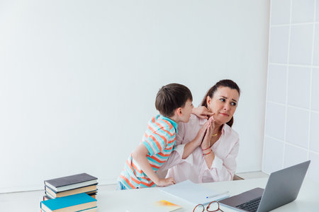 Teacher Teaching Boy On Laptop At School Onlineの写真素材
