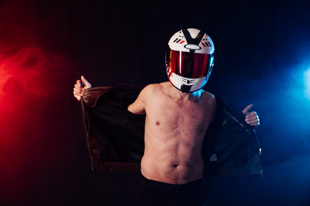 Man in a motorcycle helmet on a torsoの写真素材