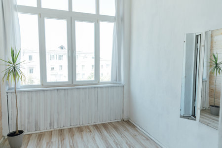 Interior of an empty gray room with a windowの写真素材