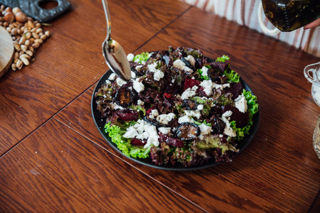 Vegetable and cheese salad prepared in the kitchen by the chef