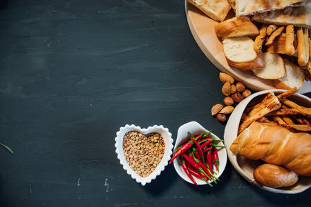Cooked bread and spices for food on a dark gray backgroundの写真素材