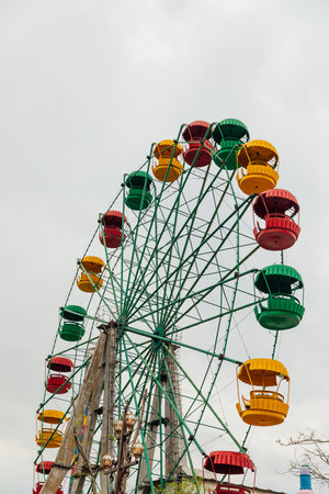 Entertainment attraction. Ferris wheel on a blue sky background.の写真素材