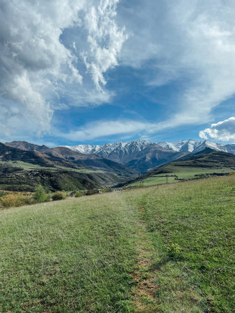 Landscape on mountains and blue sky with clouds