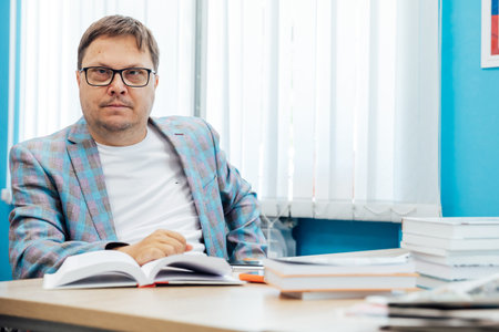 Man working on laptop at desk in office