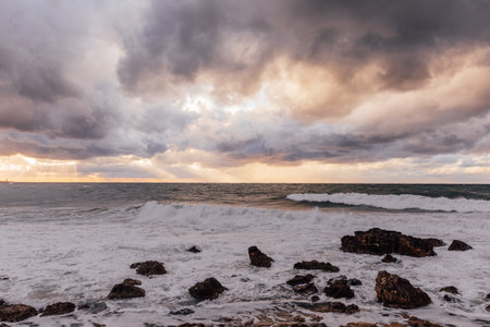 landscape, storm on the sea and sunset sky with cloudsの写真素材
