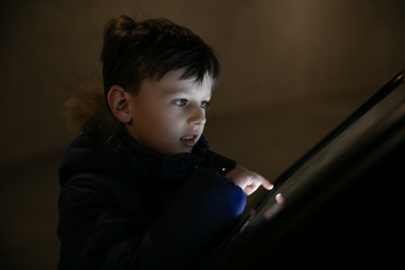 A boy studies a sensory information boardの写真素材