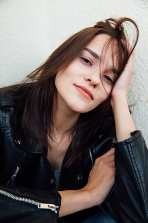 Face of gentle brunette woman with hair portrait