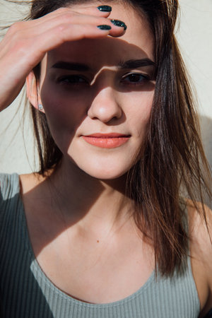 Face of gentle brunette woman with hair portraitの写真素材