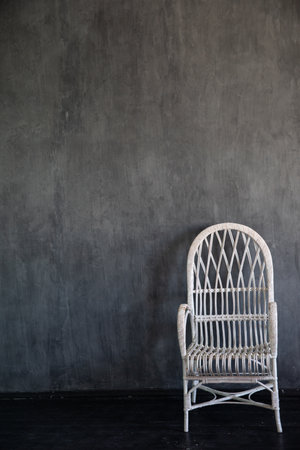 White vintage armchair in the interior of a gray roomの写真素材