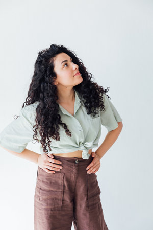 Kinky brunette woman in homemade clothes smiling portraitの写真素材
