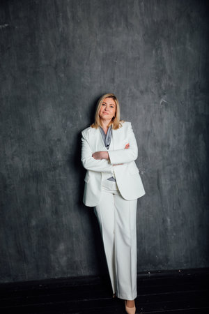 40 years old woman in white suit at workの写真素材