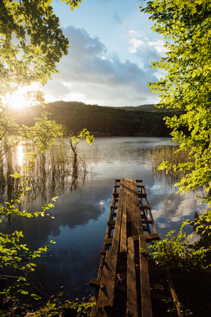Landscape of mountain forest lake and blue skyの写真素材