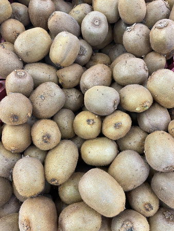 lots of ripe kiwi fruit for food as backgroundの写真素材