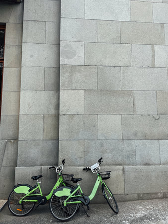 Two bicycles by the stone wallの写真素材