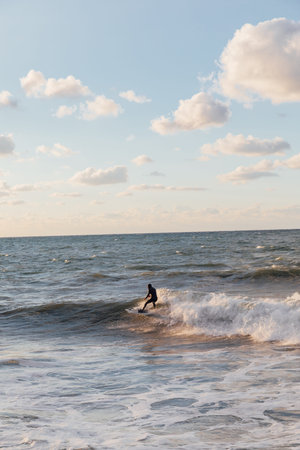 Sportsman riding the waves on a surfboard