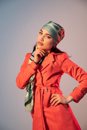 Portrait of a beautiful fashionable slim brunette woman in a red summer dressの写真素材