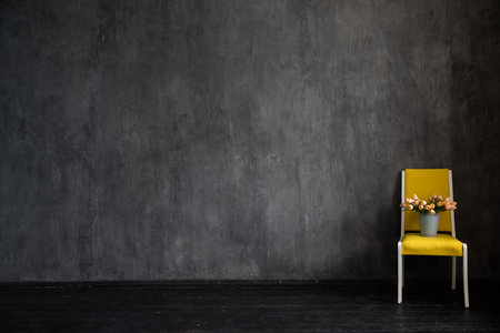Yellow vintage chair in the interior of an empty roomの写真素材