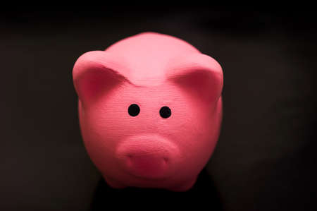 Close-Up of a pink piggy Bank On a Black Backgroundの写真素材