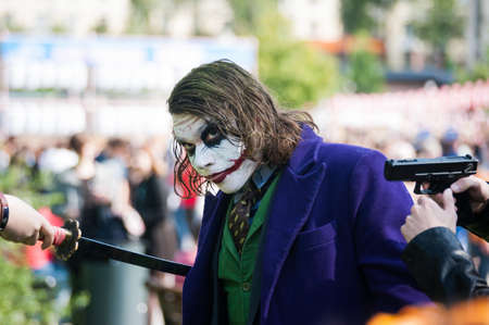 Russia, Moscow-July 21, 2019: j-FEST festival of Japanese culture, cosplay of the Joker with a sword and a gun.のeditorial素材