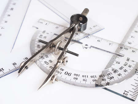 Drawing tools, school supplies. Ruling pen, ruler, triangle, on a white background.の写真素材