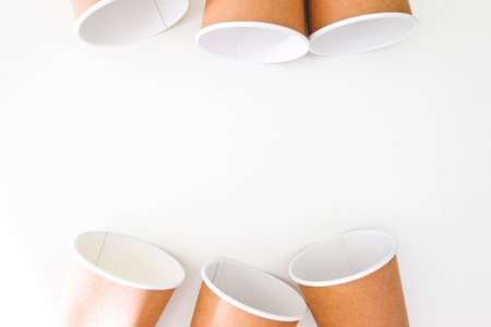 six disposable paper cups made of cardboard on a white background with space for text.の写真素材