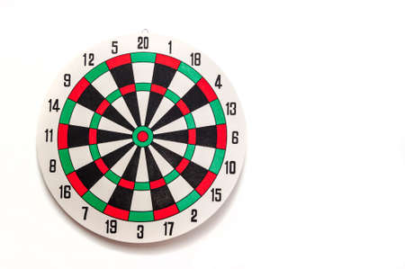 Round dartboard colored on a white background with a copy of the space.の写真素材