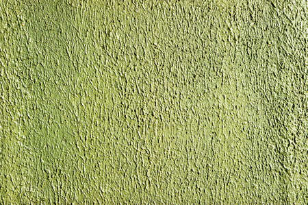 Plaster wall texture of concrete covered with paint with an interesting pattern of green color.の写真素材