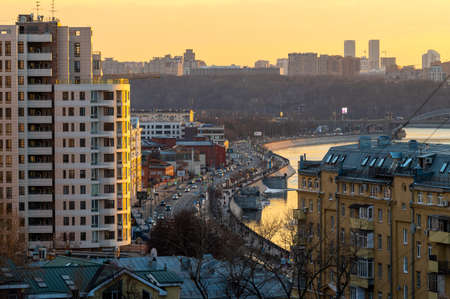 MOSCOW, RUSSIA - MARCH 29, 2021: Evening panoramic view from above of the embankment, road, high-rise buildingsのeditorial素材