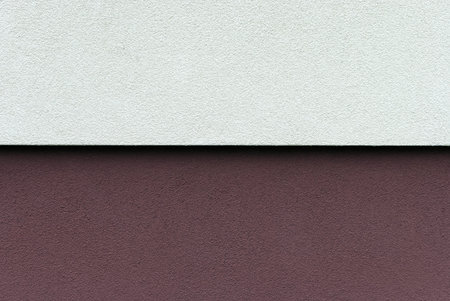 white and maroon wall of the house