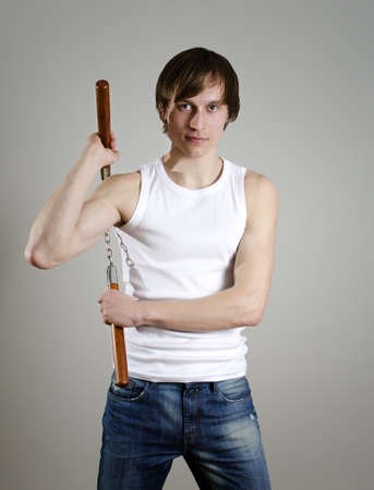 Martial Art. Man with nunchucksの写真素材