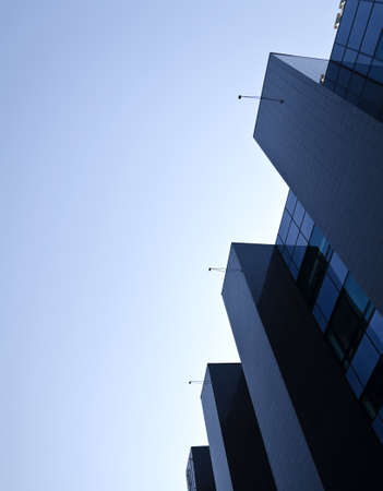 Office building under blue cloudless skyの写真素材
