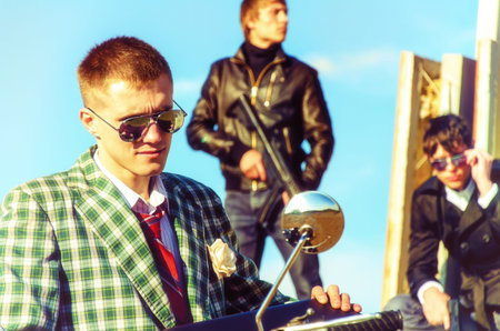 Mafia: Three thugs with a suitcase and weaponsの写真素材