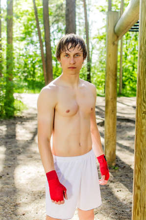 Portrait of boxer guy in forestの写真素材