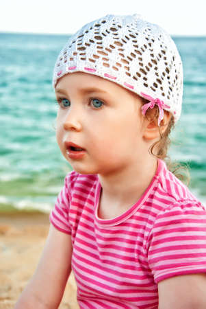 Portrait of cute little girl on the beachの写真素材