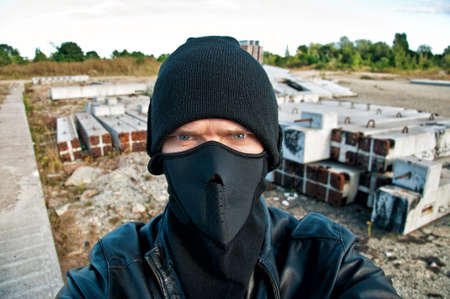 Concept photo. Thief takes off security cameraの写真素材