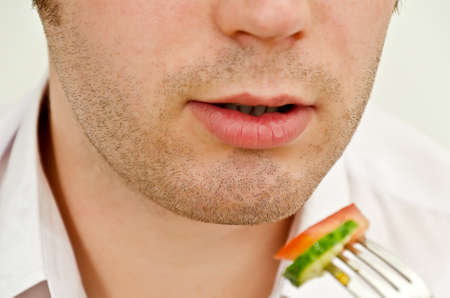Man eating salad  Close upの写真素材