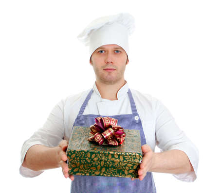 Young chef cook holding present box. Isolated on whiteの写真素材
