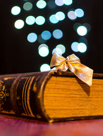 Old book on bokeh lights backgroundの写真素材