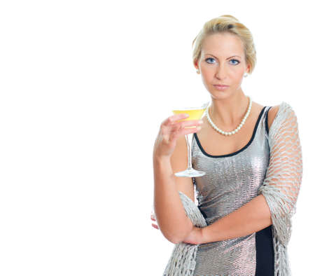 Young woman in party dress holding goblet. Isolated on whiteの写真素材