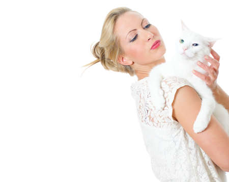 Young woman holding white cat  Isolated on whiteの写真素材
