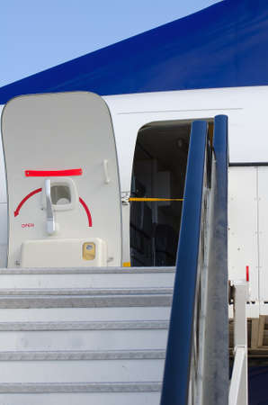 Passenger boarding stairs with open doorの写真素材