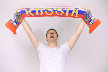 Man supports Russian team with Russian scarf の写真素材