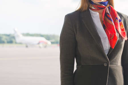 Stewardess on the airfield  Place for your text の写真素材