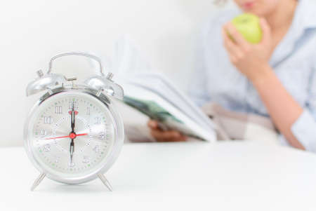 Schedule of the day  Woman resting at home, reading a book の写真素材