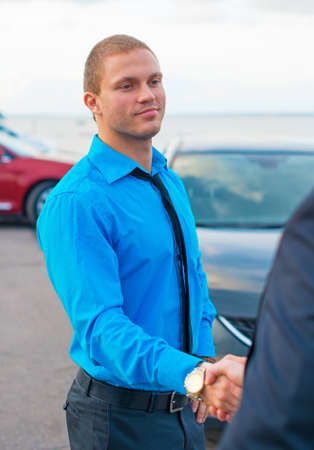 Businessmen shaking hands over a deal の写真素材